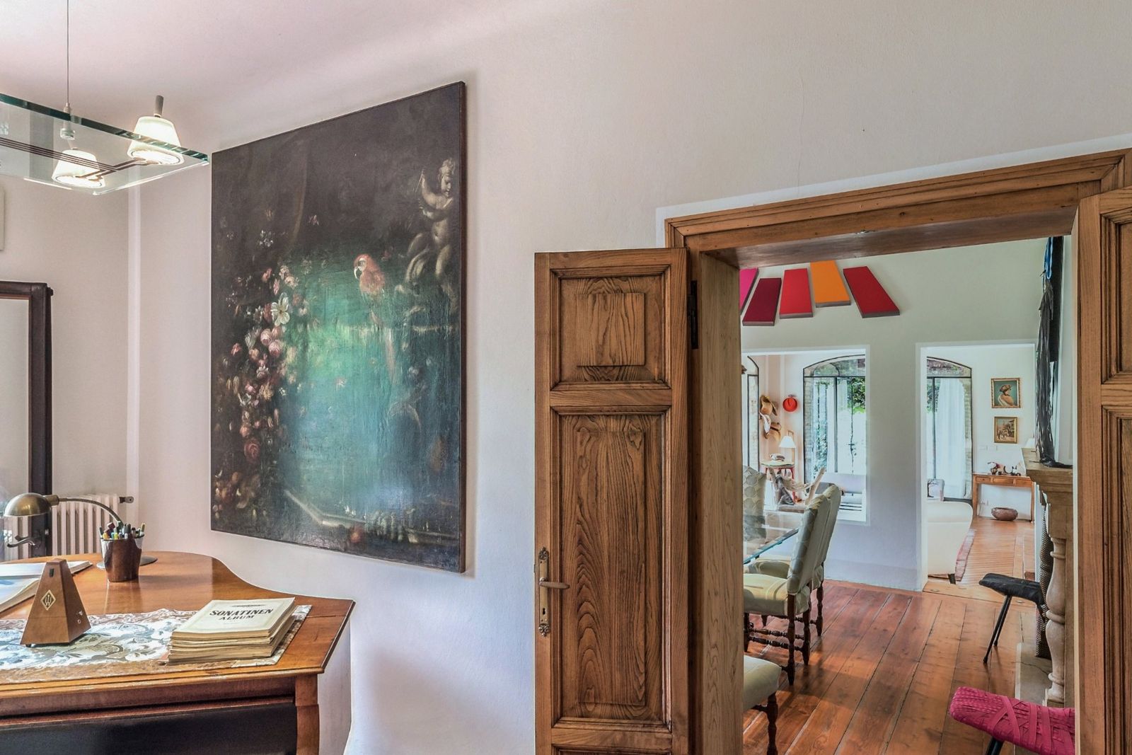 A grand piano near the doors to the garden